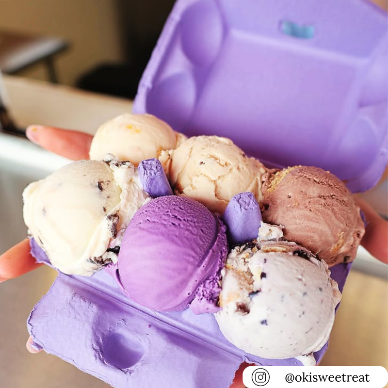 Purple 6-cell egg carton used as an ice cream container with assorted ice cream scoops.