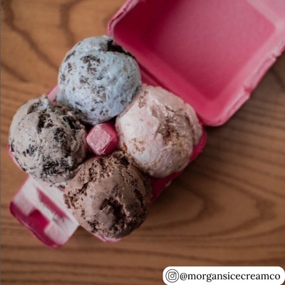 Four scoops of ice cream in a pink egg carton dessert container. 