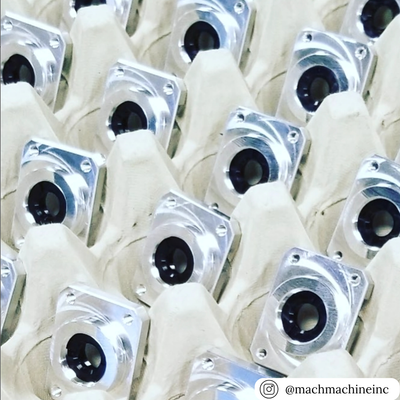 Close-up of mechanical components in a sturdy 30-cell filler flat tray