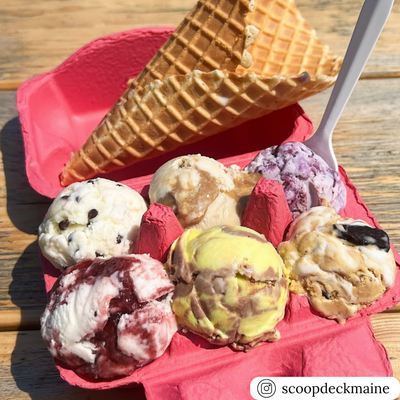Assorted ice cream scoops in a pink 6-cell egg carton